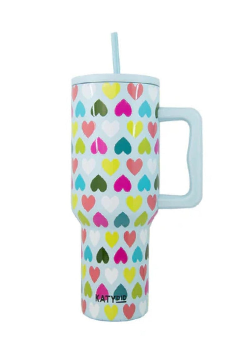 mint green tumbler with handle and multicolor heart pattern